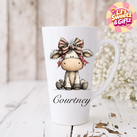 White mug with a cow design and 'Courtney' text, branded 'LJ's Sweetz & Giftz'.