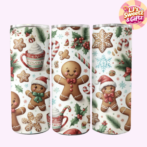 Three Christmas-themed tumblers with gingerbread men, snowflakes, and candy designs on a white background.