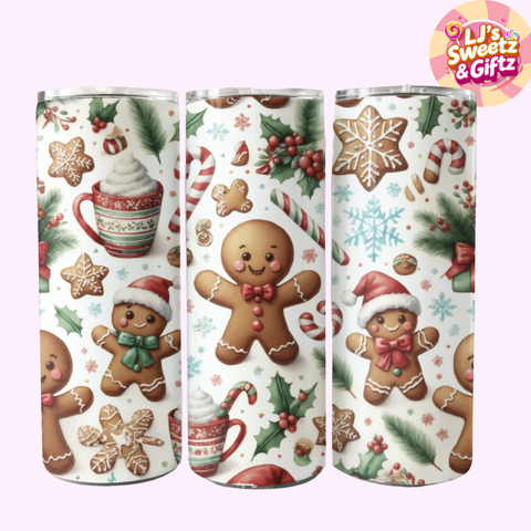 Three Christmas-themed tumblers with gingerbread men, snowflakes, and candy designs on a white background.