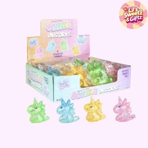 Box of colorful gel candy unicorns with packaging on a white background