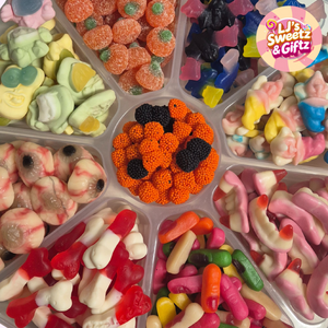 Assorted colorful gummy candies in a display tray with 'LJ's Sweetz & Gifz' branding.