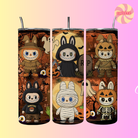 Set of four Halloween-themed tumblers with cartoon characters on a gradient background.