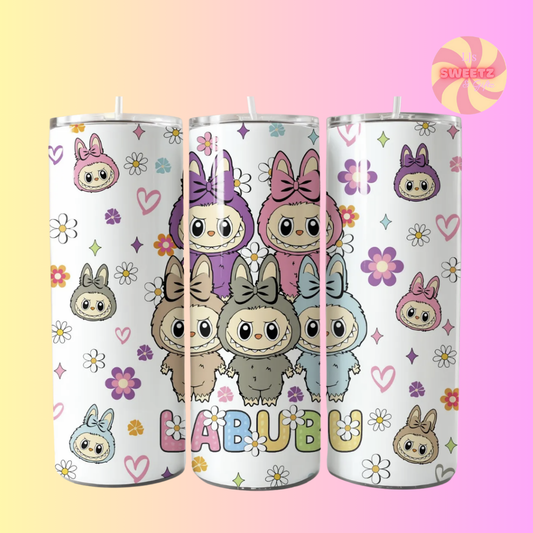 Three tumblers with cartoon character design on a gradient background