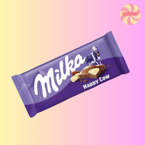 Milka Happy Cow chocolate bar on a gradient background
