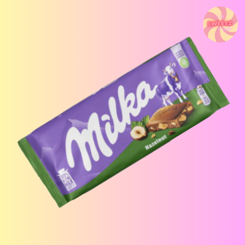Milka hazelnut chocolate bar packaging on a pastel gradient background