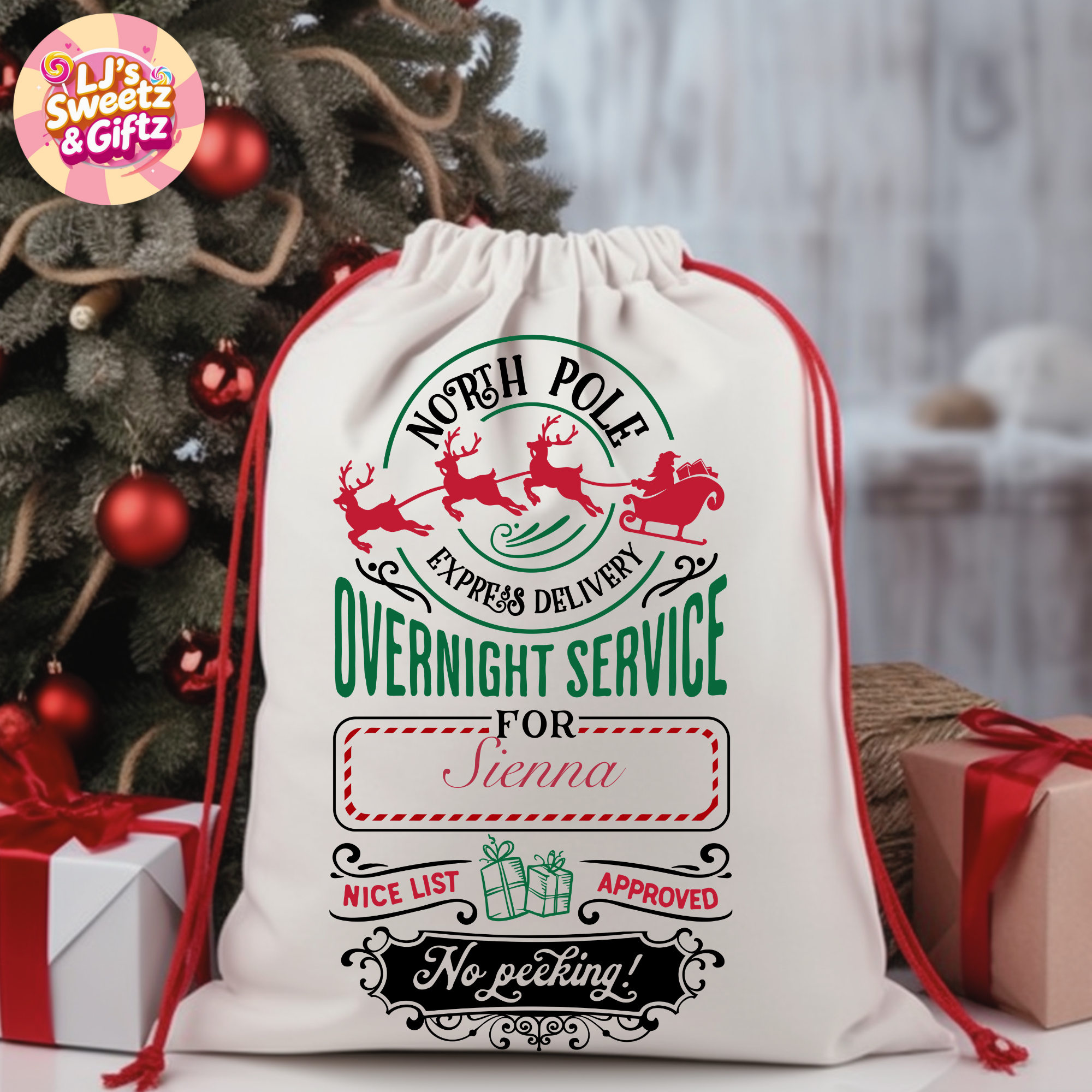 Personalized Christmas gift sack with Santa Claus design and text, placed in front of a decorated Christmas tree.