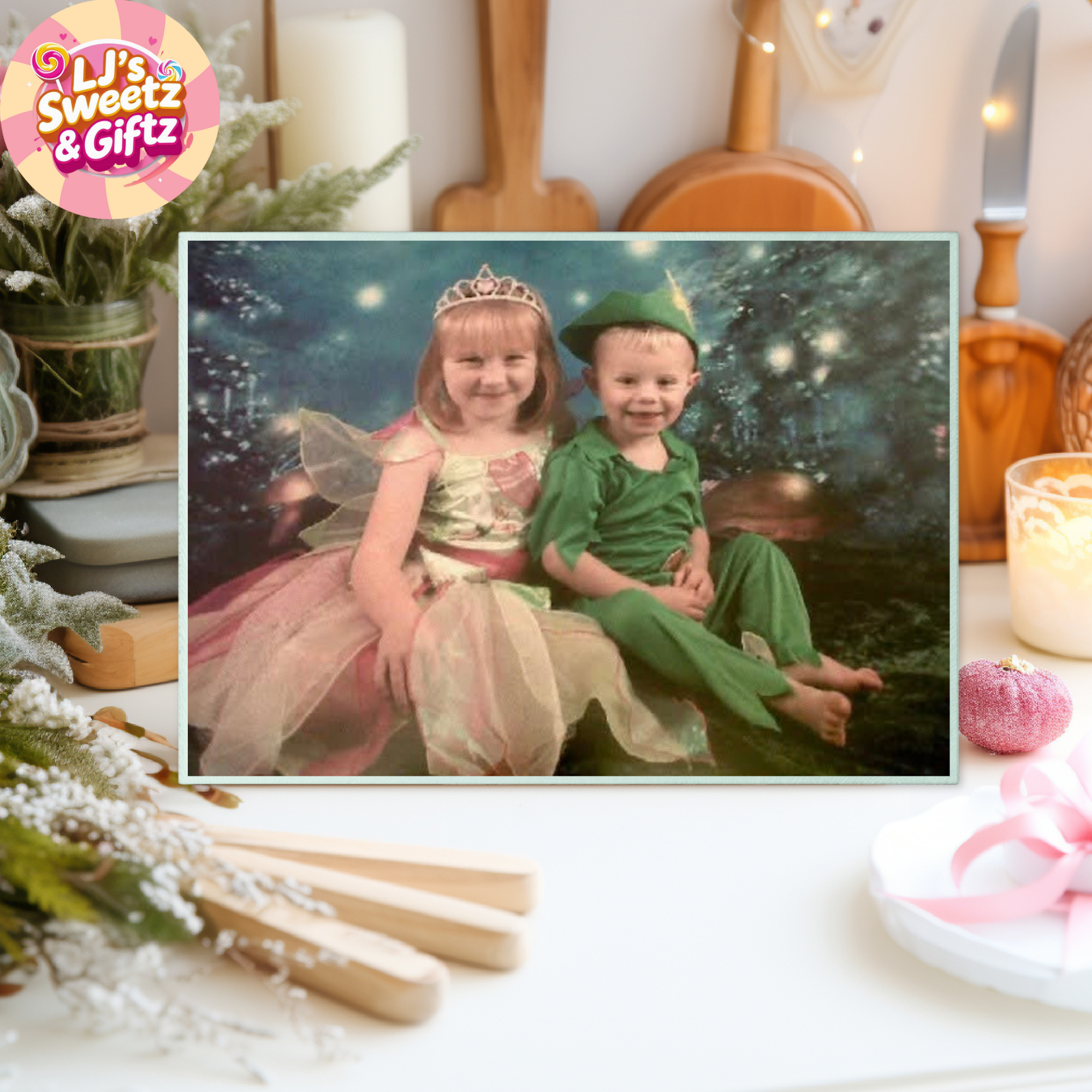 Children in fairy and Peter Pan costumes sitting together with decorative items around. Chopping Boards