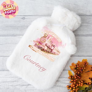 White hot water bottle with a pink and gold design and 'Courtney' text on a wooden surface, featuring the LJ's Sweetz & Giftz logo.