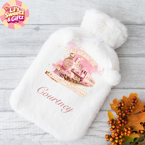 White hot water bottle with a pink and gold design and 'Courtney' text on a wooden surface, featuring the LJ's Sweetz & Giftz logo.