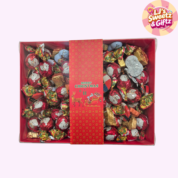 Box of Christmas-themed candy with a decorative label, featuring LJ's Sweetz & Giftz branding.