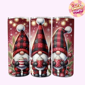 Three Christmas-themed tumblers with gnomes holding hot cocoa, featuring plaid hats and snowflake decorations.