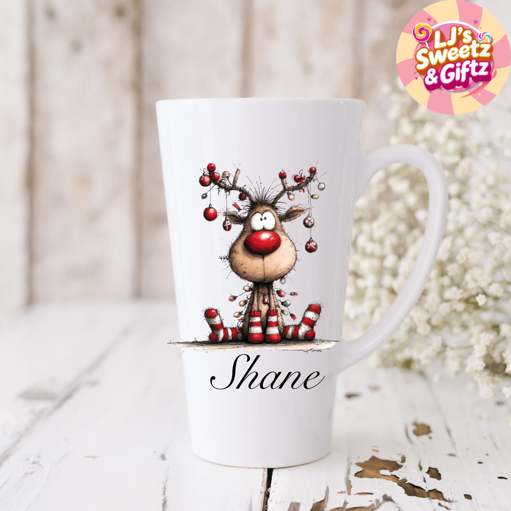 White mug with a reindeer design and 'Shane' text, branded with 'Lj's Sweetz & Giftz'.