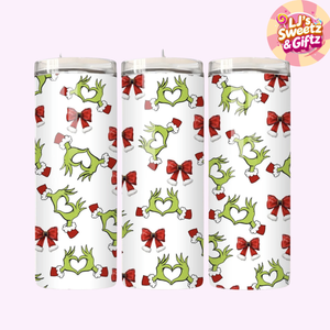 Three candles with Grinch pattern on a white background, branded 'LJ's Sweetz & Giftz'.