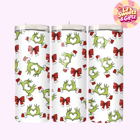 Three candles with Grinch pattern on a white background, branded 'LJ's Sweetz & Giftz'.