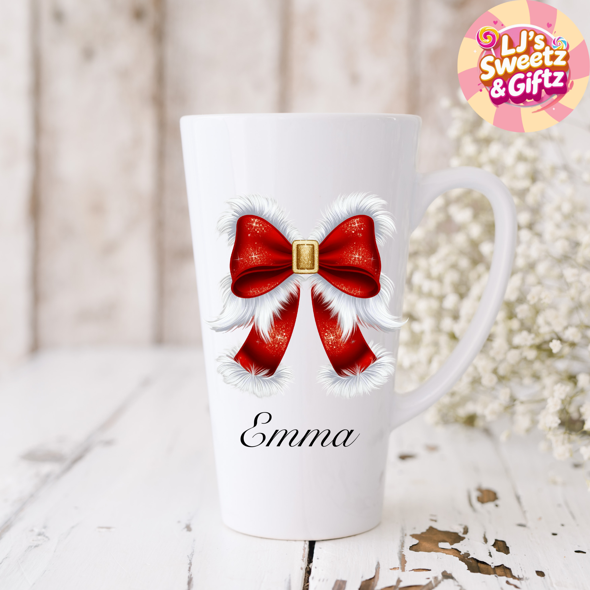 White mug with red bow design and 'Emma' text, branded 'Ljs Sweetz & Giftz'.