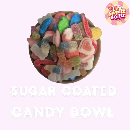 Bowl of colorful sugar-coated candy with 'LJ's Sweetz & Giftz' branding on a light pink background.